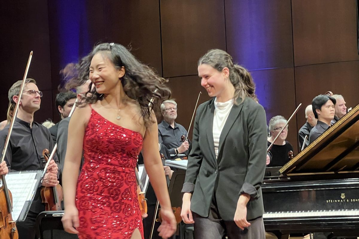 Pianist Wynona Yinuo Wang, left, and guest conductor Shira Samuels-Shragg, head off stage Saturday after they performed Clara Schumann’s “Piano Concerto in A minor, Opus 7,” with the Spokane Symphony on Feb. 28, 2026, at the Fox Theater.  (Jonathan Brunt/The Spokesman-Review)