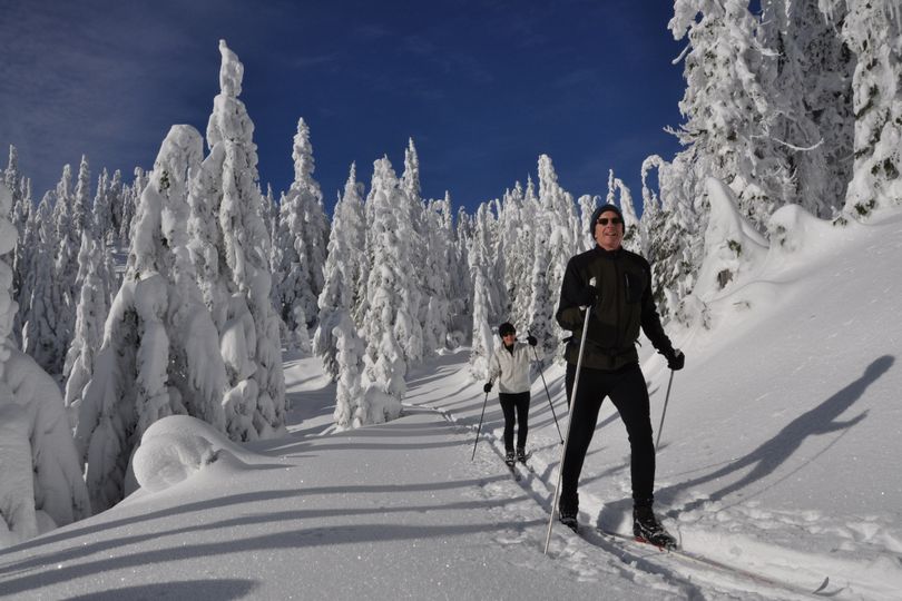 Brian and Anne Grow leave the groomed trails behind to enjoy some old-style cross-country gliding on skier-made tracks at Mount Spokane. (Rich Landers)