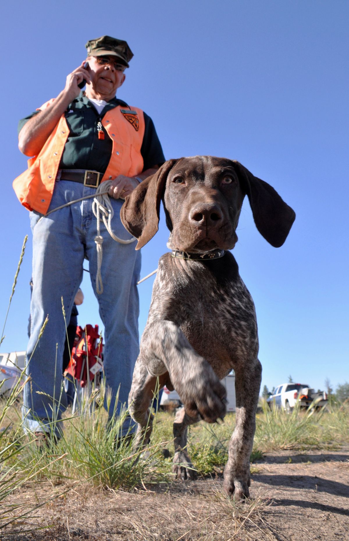 Jack Dolan of Medical Lake, stages his bird dog pup, Chip, before an outdoor session with 40 hunter ed students. (RICH LANDERS PHOTOS)