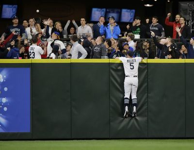 Where will Brad Miller and the Mariners’ fans be hanging out in the postseason? Sadly, not at Safeco. (Associated Press)