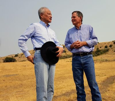In this Sept. 8, 2017 photo, Chinese ambassador to the United States Cui Tiankai, left, speaks with Republican Montana Sen. Steve Daines about ways to expand the Chinese market for Montana beef. (Tom Lutey / The Spokesman-Review)