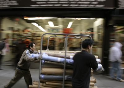 Rolls of fabric are wheeled through New York’s Garment District. The retail industry relies on the CIT Group as a key lender to keep shipments flowing to stores.  (File Associated Press / The Spokesman-Review)