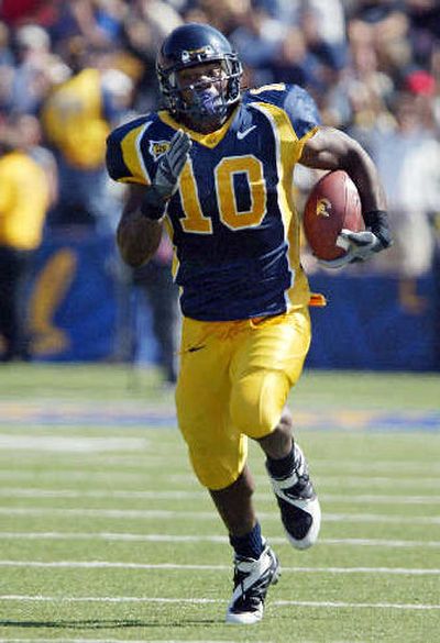 
Cal's Marshawn Lynch runs for 40 of his 124 yards on the day.
 (Associated Press / The Spokesman-Review)
