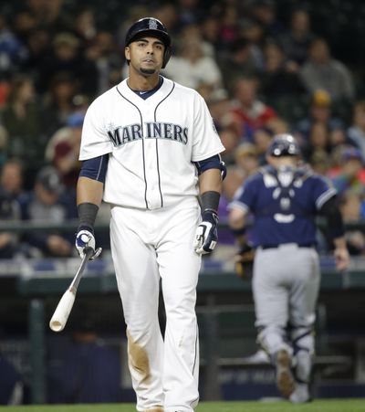 M’s Nelson Cruz walks away after striking out in fifth. (Associated Press)