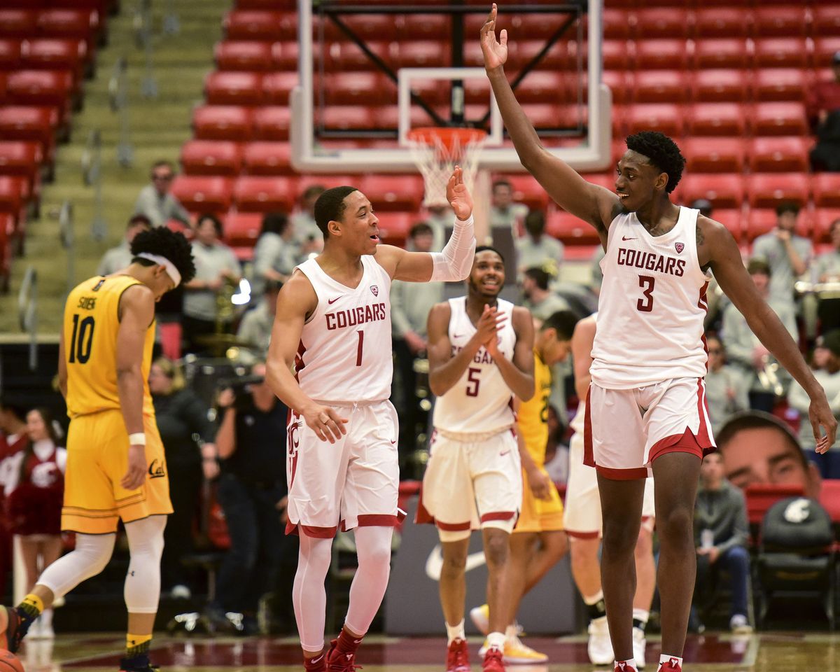 Washington State guard Jervae Robinson (1) and forward Robert Franks (3) celebrate after California coach Wyking Jones called a timeout during the second half of an NCAA college basketball game Thursday, Jan. 17, 2019, in Pullman, Wash. Washington State won 82-59. (Pete Caster / AP)