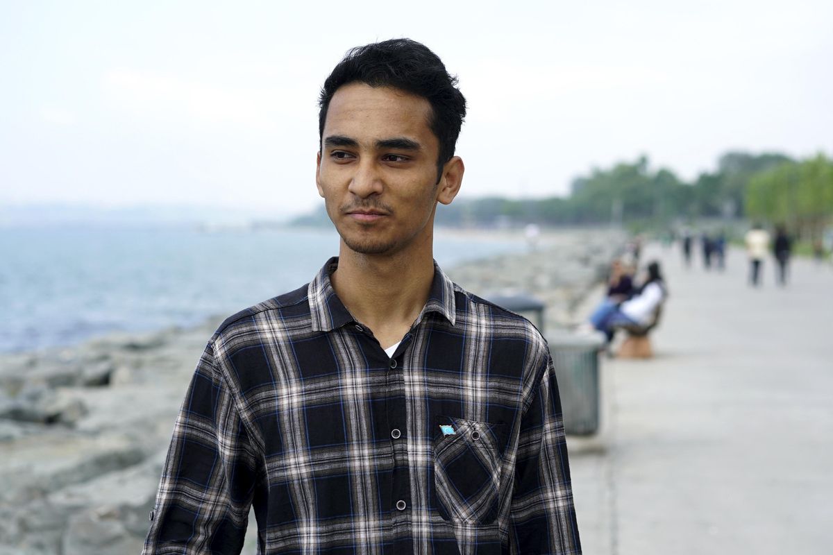 Kamilane Abudushalamu is photographed May 18, 2019, along a walkway by the Mediterranean Sea in Istanbul, Turkey.  Abdushalamu was 9 years old on July 5, 2009, when Uighurs attacked Han civilians prompting clashes that killed an estimated 200 people. Analysts say the Urumqi riots in 2009 set in motion the harsh security measures now in place across Xinjiang, where about 1 million Uighurs, Kazakhs and other Muslims are estimated to be held in heavily-guarded internment camps – also called “re-education” camps – which the Chinese government describes as vocational training centers. (Dake Kang / Associated Press)