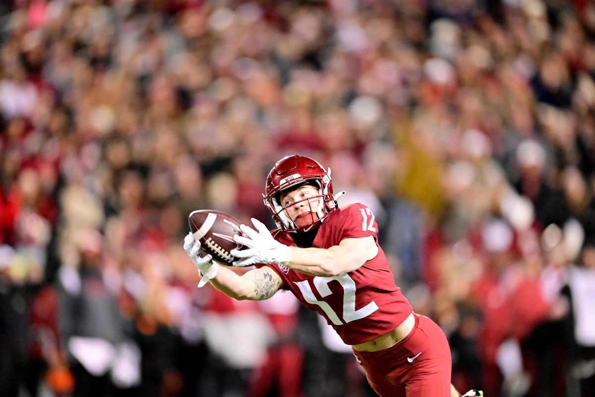 Washington State receiver Robert Ferrel stretches out for a long pass that was ultimately ruled incomplete during the first half of the Apple Cup against Washington on Nov. 26 at Gesa Field in Pullman.  (Tyler Tjomsland/The Spokesman-Review)