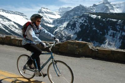 
Even on sunny spring days, Glacier cyclists usually must bundle up for the long descent. 
 (The Spokesman-Review)