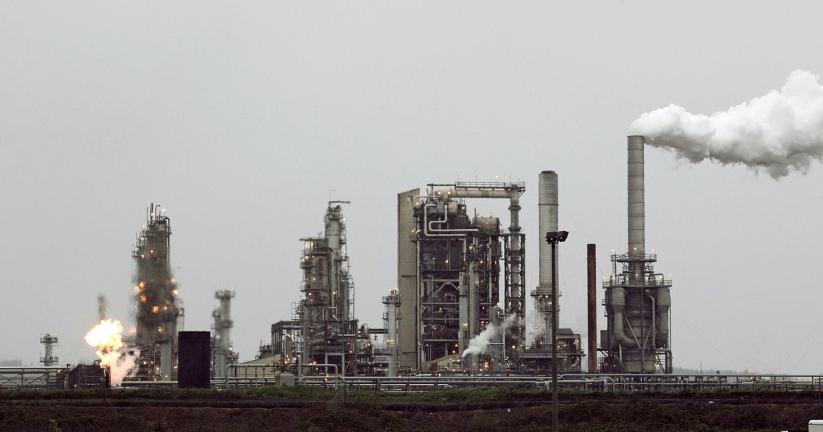 A Tesoro Corp. refinery, including a gas flare flame that is part of normal plant operations, is seen April 2, 2010, in Anacortes, Wash. (Ted S. Warren / AP)