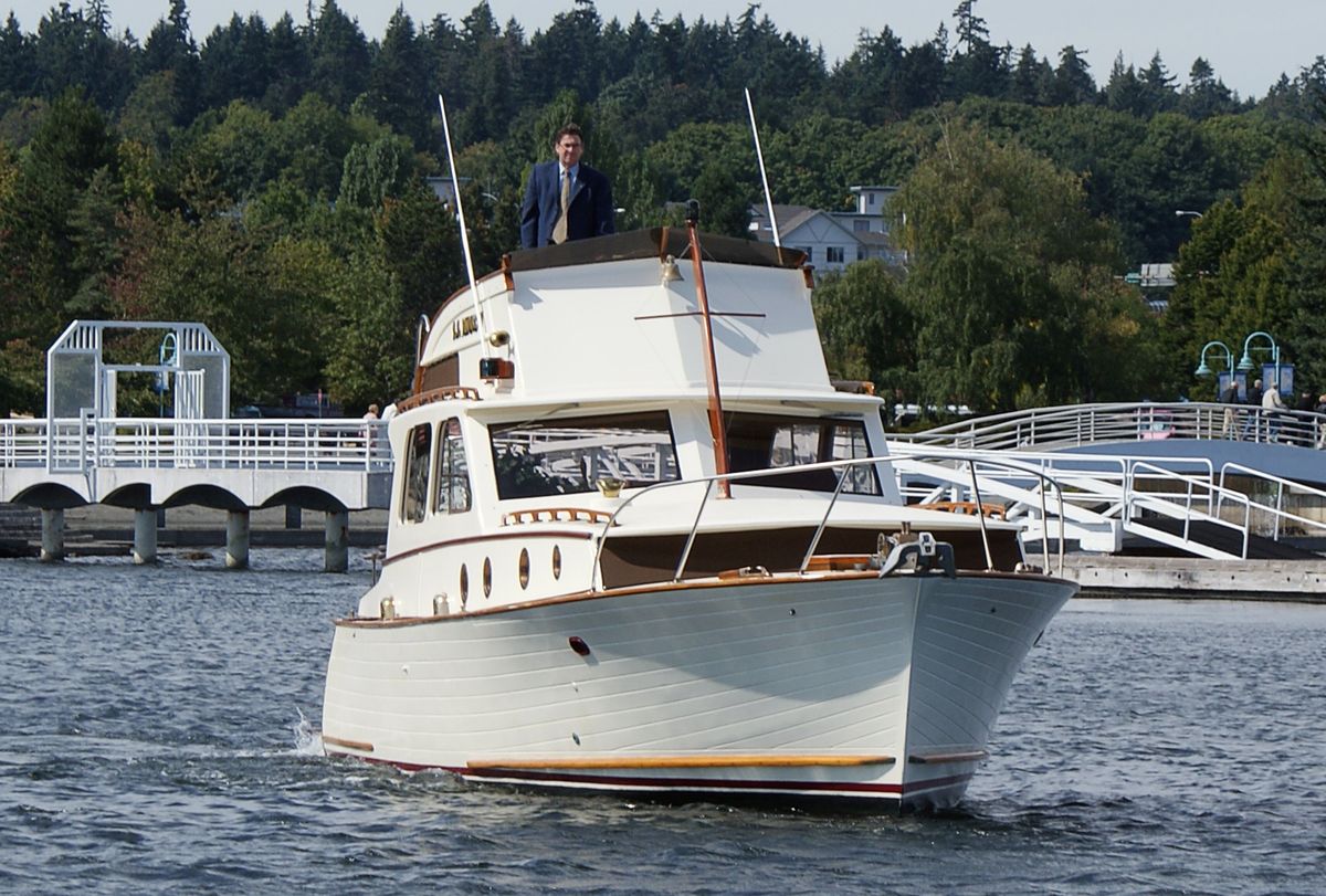 Ken Schley navigates the SS Minnow around Nanaimo Harbor in Canada on Sept. 8.  (Associated Press / The Spokesman-Review)