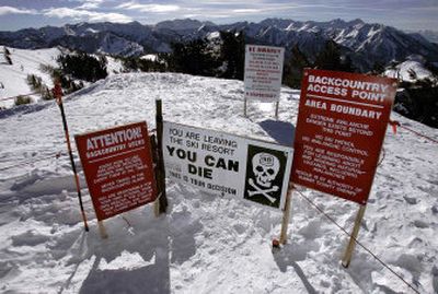 
Warning signs mark the boundary of The Canyons Ski Resort outside Park City, Utah, just like at many ski resorts. According to a report Monday, the U.S. Forest Service said that although leaving a resort to ski out of bounds on public land may not be very smart, it is not a crime. 
 (Associated Press / The Spokesman-Review)