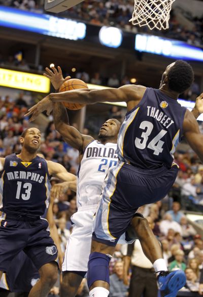 Hasheen Thabeet, right, and Grizzlies held the Dallas Mavericks to just 15 fourth-quarter points in 91-90 Memphis victory. (Associated Press)