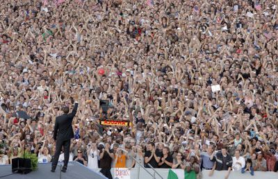 Sen. Barack Obama, D-Ill., waves to the audience as he arrives at the Victory Column in Berlin on Thursday.  (Associated Press / The Spokesman-Review)