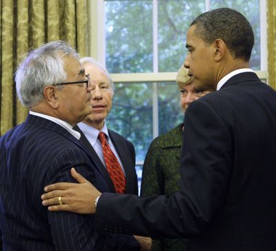 President Barack Obama talks with Rep. Barney Frank, D-Mass., after signing a presidential memorandum extending some benefits to same-sex partners of federal employees. (Associated Press / The Spokesman-Review)