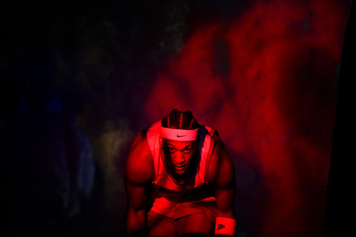 A WSU logo is projected on a screen of mist as Washington State Cougars forward Isaac Jones emerges from the tunnel during player introductions before facing Stanford during the first half of a Pac-12 basketball tournament game on March 14 at T-Mobile Arena in Las Vegas.  (TYLER TJOMSLAND/THE SPOKESMAN-REVIEW)