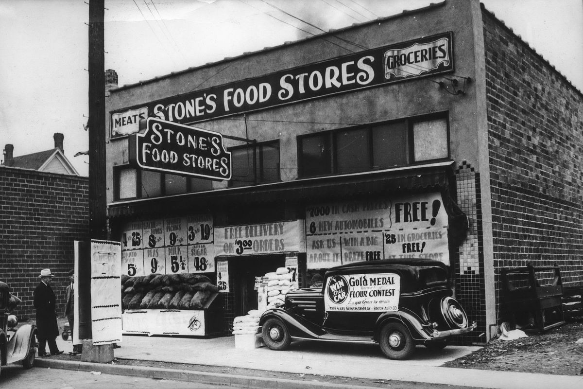 1934: The Stone’s Food Stores location at 319 S. Cedar St., was one of the first opened by Roy L. Stone after he stepped away from the merger of Safeway and his previous employer, MacMarr Stores, around 1931. Stone’s Food Stores were sold to Sigman Foods in 1946 and Stone would try another grocery chain with Low Cost Foods in 1951. The automobile in front was to advertise a contest by the Sperry Flour Mills, where the prize was a new car.  (THE SPOKESMAN-REVIEW PHOTO ARCHIVES)