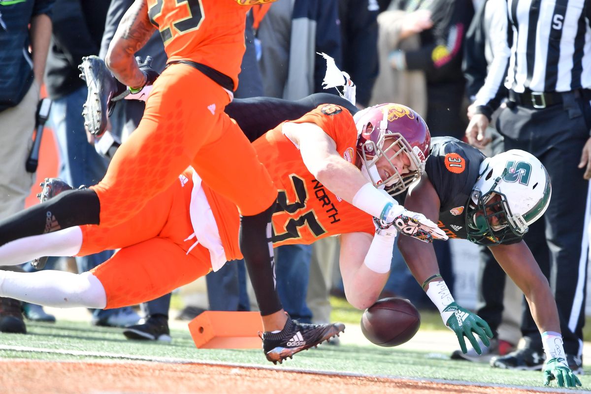 South running back Wes Hills of Slippery Rock (31) leaps into the end zone against North inside linebacker Cameron Smith of USC (35) to set up a first and goal situaion which the South capitalized on with a touchdown during the first half of the 2019 Senior Bowl on Saturday, January 26, 2019, at Ladd-Peebles Stadium in Mobile, Ala. (Tyler Tjomsland / The Spokesman-Review)