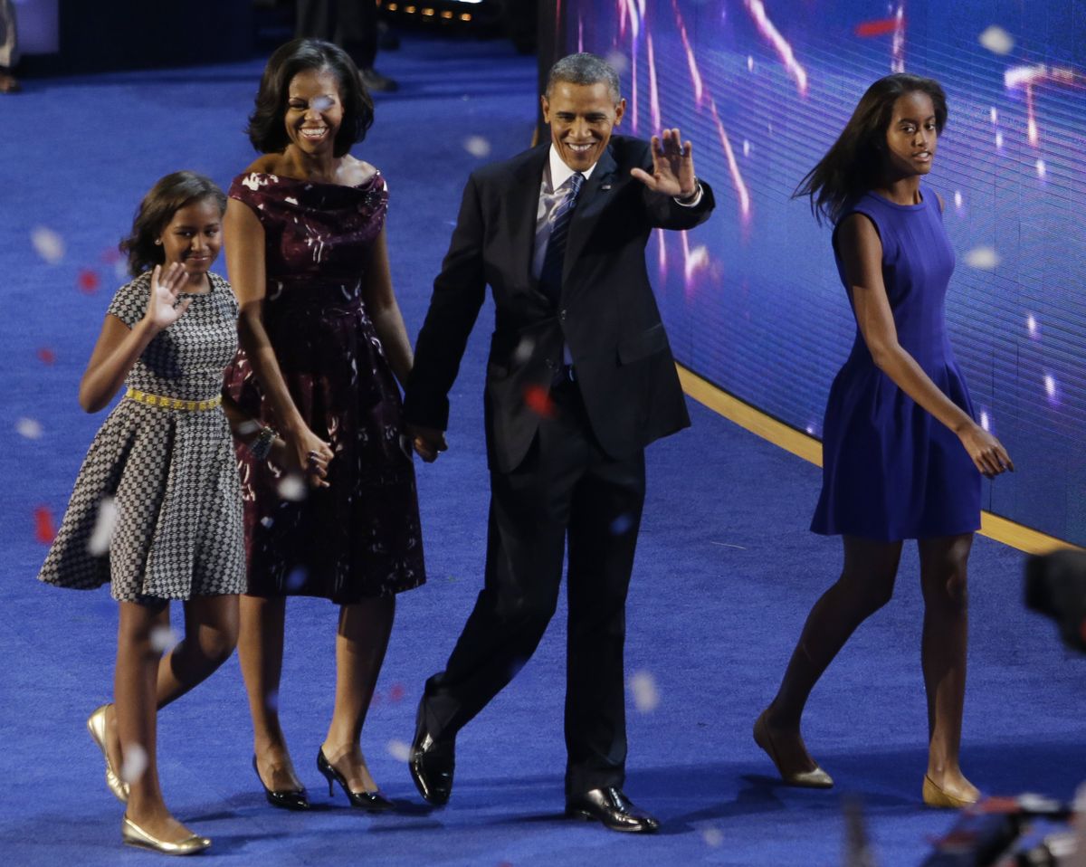 President Barack Obama and his family, Michele, Sasha, left and Malia, right exit the stage at the Democratic National Convention in Charlotte, N.C., on Thursday, Sept. 6, 2012. (Lynne Sladky / Associated Press)
