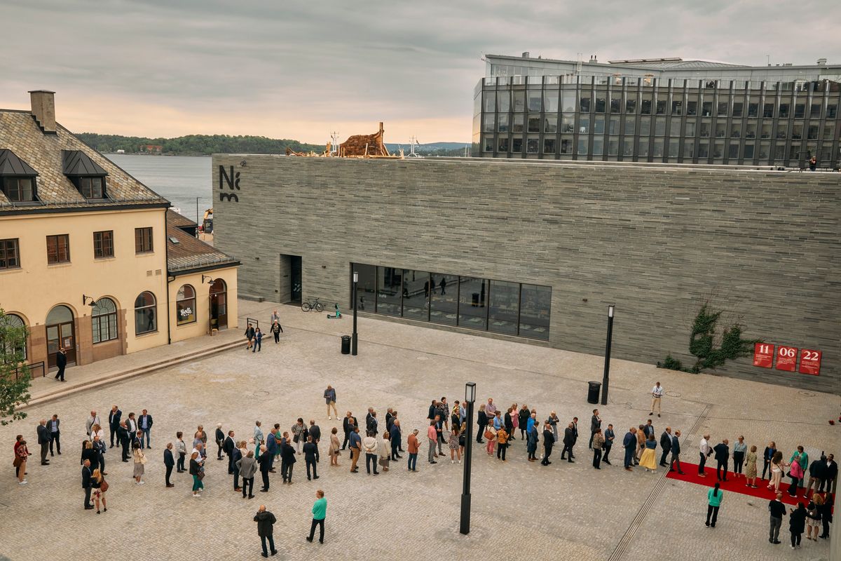 People wait to enter the new National Museum, in Oslo, Norway, June 7, 2022. City administrators hope the museum will help Oslo, and the rest of the country, step out of its Scandinavian neighbors