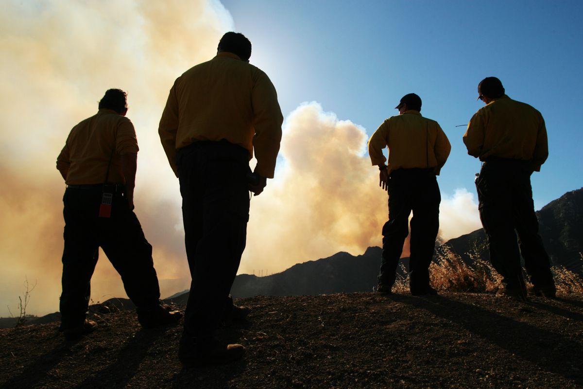 Firefighter watch flames reach the ridge above Rattlesnake Canyon on Thursday in Santa Barbara, Calif. (Associated Press / The Spokesman-Review)