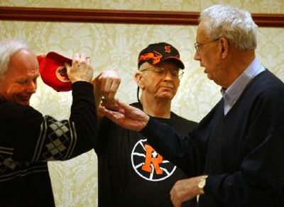
Steve Deal, left, and Mike Day, center, help Hank Coplen conduct the tournament draw on Sunday. 
 (Liz Kishimoto / The Spokesman-Review)
