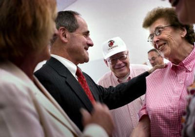 
Gov. Jim Risch greets Lidwin Dirne at the Dirne SAGE Clinic recently in Coeur d'Alene on one of his trips to the Panhandle. 
 (Jed Conklin / The Spokesman-Review)