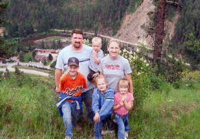 
Brett and Karleen Stanley and their children — from left, Craig, Caleb, Kassandra and Keera — are pictured during their camping trip near the St. Joe River, before Caleb became ill.
 (Photos courtesy of the Family / The Spokesman-Review)