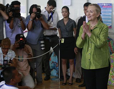 U.S. Secretary of State Hillary Rodham Clinton, right, greets Thai flood victims during a visit to an evacuation center in Bangkok, Thailand, on Thursday. (Associated Press)