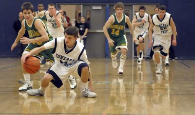 Gonzaga Prep’s David Stockton heads upcourt after stealing the ball from Richland’s Dylan Radliff. (Christopher Anderson / The Spokesman-Review)