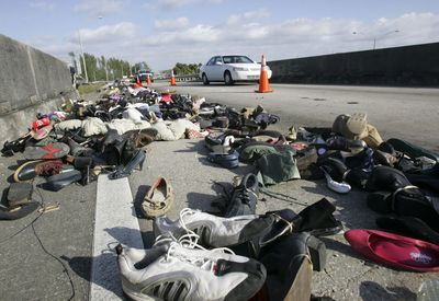 Thousands of shoes were dumped on the Palmetto Expressway, causing significant traffic delays in Miami on Friday.  (Associated Press / The Spokesman-Review)