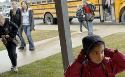 Priest River Elementary preschooler McKinzi Tanner adjusts her hat Tuesday. The city of Priest River was awarded a Safe Routes to Schools Grant by ITD.
(Kathy Plonka / The Spokesman-Review)