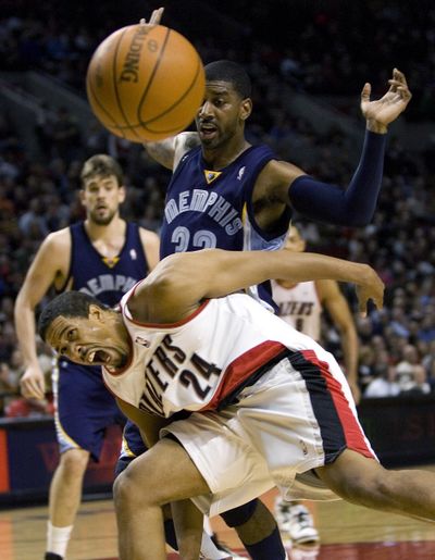 Portland guard Andre Miller (24) reacts after losing the ball out of bounds while being guarded by Memphis’ O.J. Mayo.  (Associated Press)