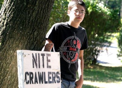 
Joey Cadieux, 13, has been forced by town officials to remove a sign advertising worms for sale from the family's Cromwell, Conn., front yard, a move that set off a flurry of protests.
 (Associated Press / The Spokesman-Review)