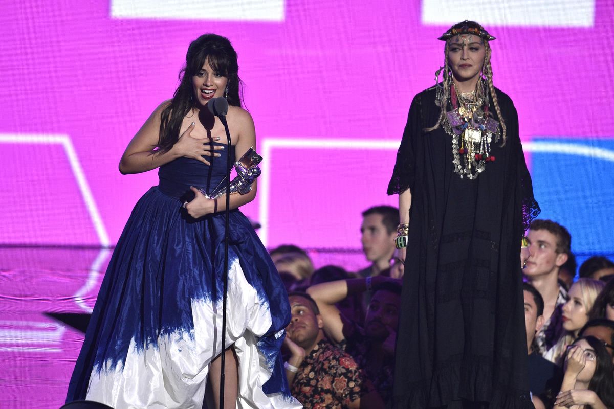 Camila Cabello, left, accepts the award for video of the year as presenter Madonna looks on at the MTV Video Music Awards at Radio City Music Hall on Monday, Aug. 20, 2018, in New York. (Chris Pizzello / Invision/Associated Press)