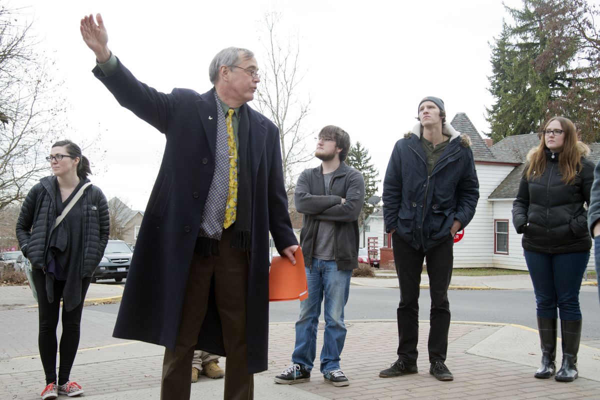 Professor Larry Cebula, second from left, talks with his students on a Cheney street corner about the lynching of an Indian man in 1884 near the campus of Eastern Washington University. Cebula, a history professor, taught a lesson about lynching and frontier justice in local history. (Jesse Tinsley)