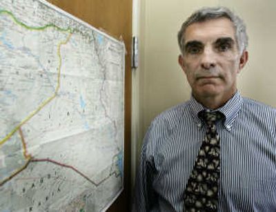 
Phil Lynch, an assistant U.S. attorney, stands next to a map of Iraq on Friday in his office in Tacoma. Associated Press
 (Associated Press / The Spokesman-Review)