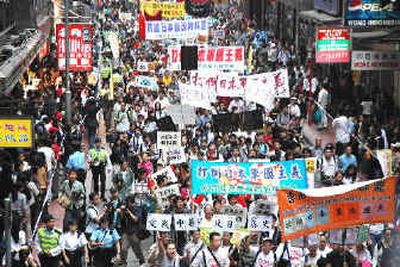 
About 5,000 demonstrators march on a Hong Kong street Sunday to denounce Japanese wartime atrocities. Similar protests took place on China's mainland.
 (Associated Press / The Spokesman-Review)