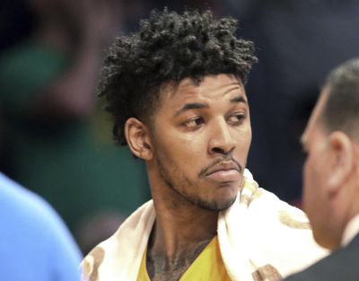 In this March 17, 2017 file photo, Los Angeles Lakers guard Nick Young is ejected from a game after a scuffle during a basketball game against the Milwaukee Bucks in Los Angeles. Los Angeles police say NBA free agent Young was arrested in Hollywood during a late-night stop for a routine traffic violation late Friday, Aug. 24, 2018. (Reed Saxon / Associated Press)