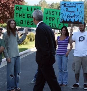 Robert Gordon, an attorney with Weitz & Luxenberg who represents plaintiffs in the oil spill lawsuits, walks past demonstrators outside Federal Court in Boise, Idaho, where the U.S. Judicial Panel on Multidistrict Litigation meets Thursday, July 29, 2010 in Boise, Idaho. The panel is being asked to consolidate more than 300 spill-related lawsuits against BP and other companies before a single court.
 (Paul Hosefros / AP Photo)