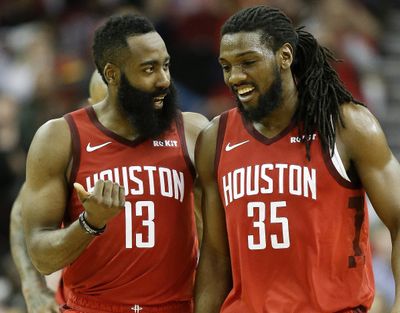 Houston Rockets guard James Harden (13) talks with forward Kenneth Faried late in the second half of an NBA basketball game against the Toronto Raptors, Friday, Jan. 25, 2019, in Houston. (Eric Christian Smith / Associated Press)