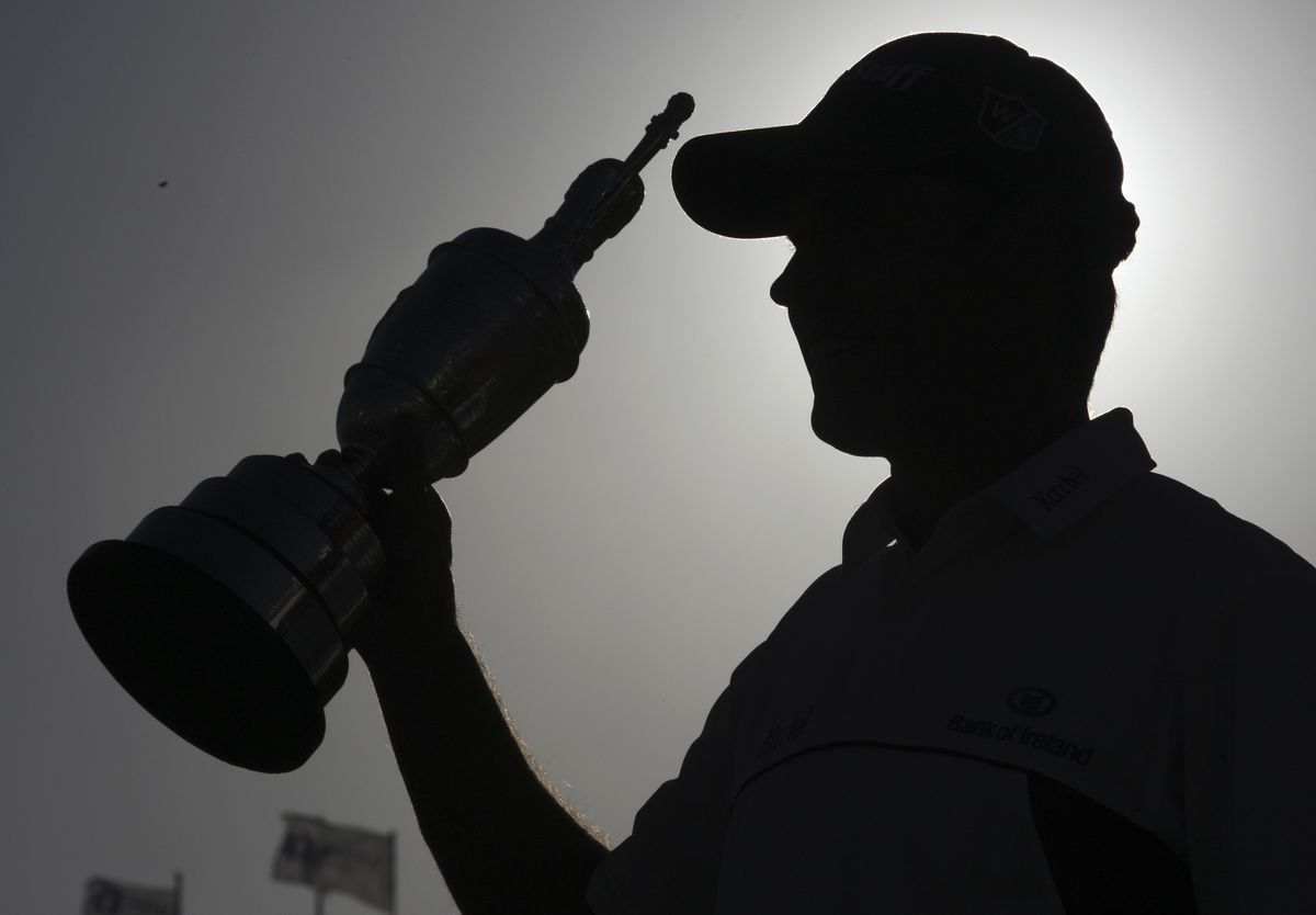 Padraig Harrington of Ireland holds the oldest trophy in golf as he celebrates his second consecutive British Open victory. (Associated Press / The Spokesman-Review)