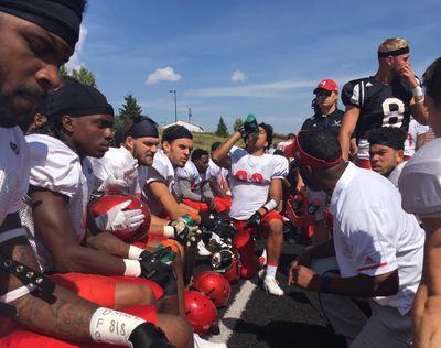 Eastern Washington receivers get an earful from assistant coach Jay Dumas during Saturday’s scrimmage. (Jim Allen / The Spokesman-Review)