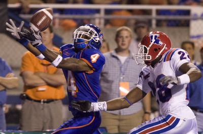 BSU’s Titus Young hauls in a pass ahead of Louisiana Tech’s Terry Carter in the second half.  (Associated Press / The Spokesman-Review)