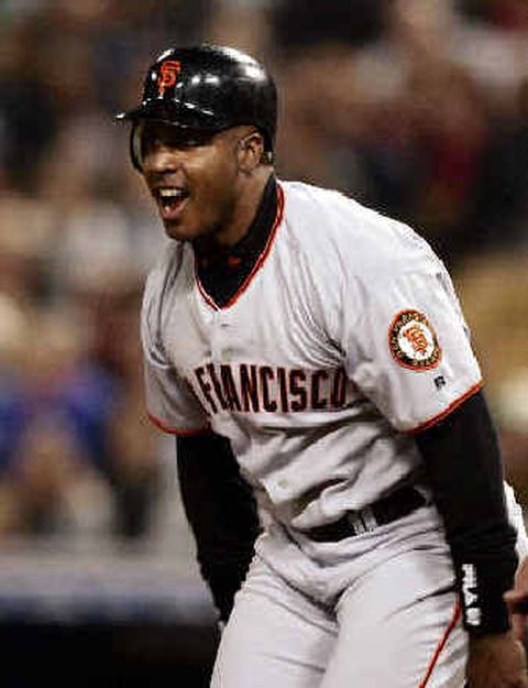 Oct 23, 2002 - Anaheim, CA, USA - San Francisco Giants pitcher KIRK RUETER  runs up the line for a single in the 5th inning of game 4 of the 2002 World