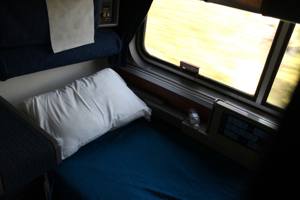 A roomette aboard Empire Builder is a small private compartment that has two seats that convert to a bed and an overhead top bunk that folds down.