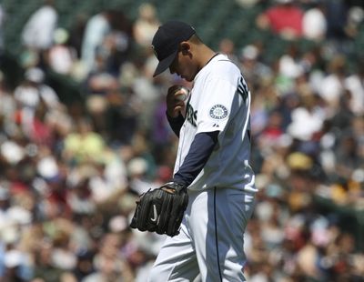 Mariners starter Felix Hernandez struck out a season-high 10 batters and earned his first victory since April 28. (Associated Press / The Spokesman-Review)