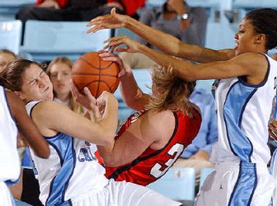 
Davidson's Brynn Kelly, center, battles for the ball with North Carolina players earlier this season. 
 (Associated Press / The Spokesman-Review)
