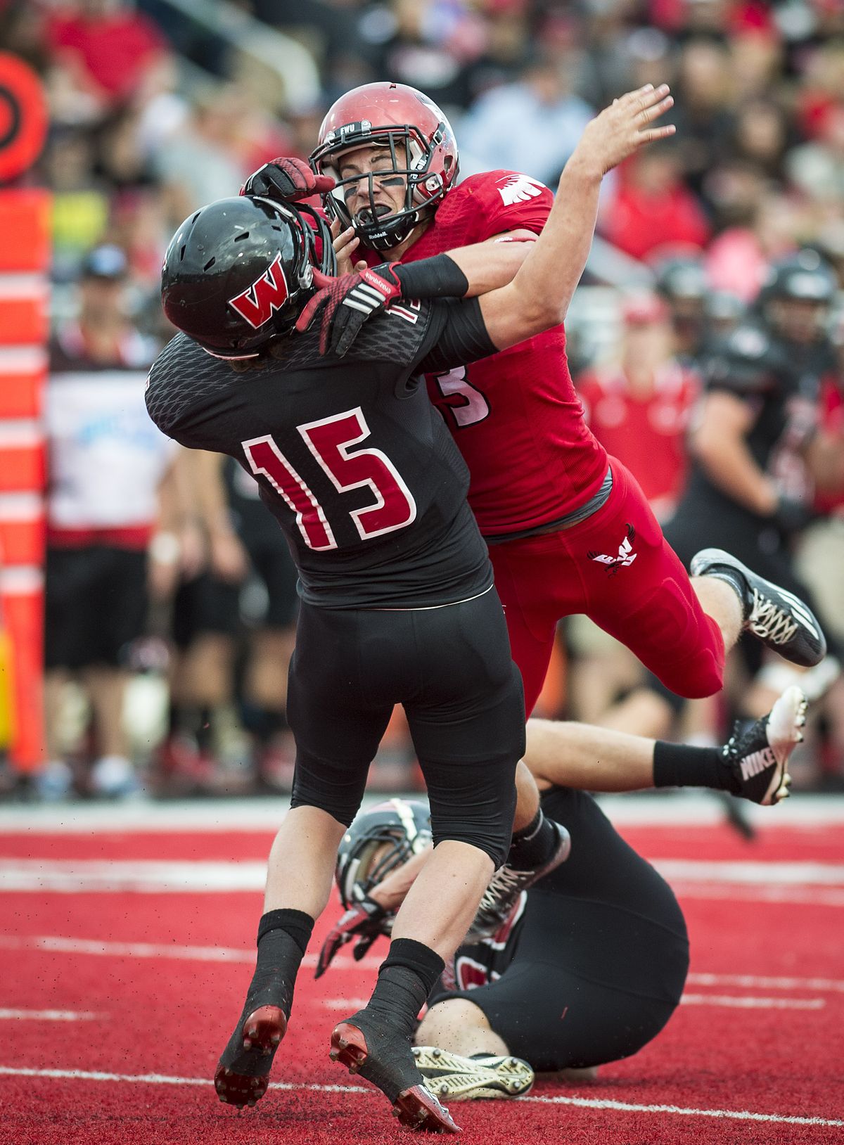 Eastern Washington University defensive lineman Marcus Saugen hits Montana Western quarterback Tyler Hulse in the first half. (Colin Mulvany)