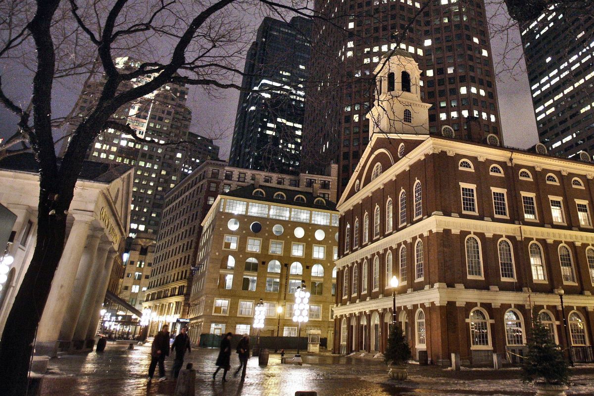 In this Feb. 22, 2007 file photo, Faneuil Hall, right, appears at night in downtown in Boston. Faneuil Hall is one of the historic sites on Boston’s Freedom Trail. (Michael Dwyer / Associated Press)