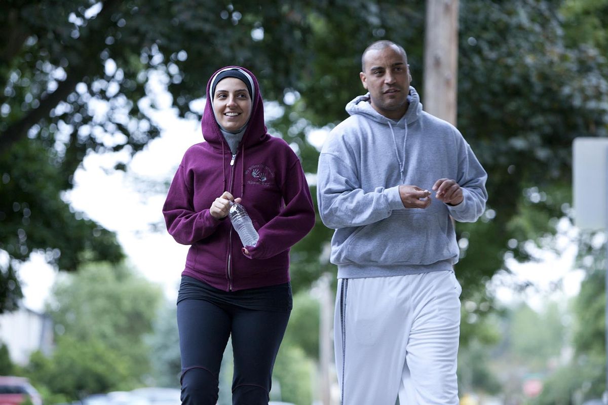 In this undated image provided by Discovery, Nawal Aoude and her husband, Nader, go for a walk in a scene from the TLC series “All-American Muslim.” Lowe’s pulled advertising from the show under pressure from a conservative group in Florida. (Associated Press)